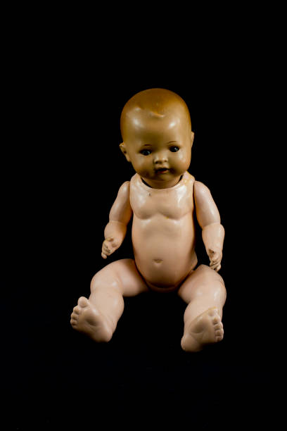 istock Boy Toy Doll on Black Background 682279602