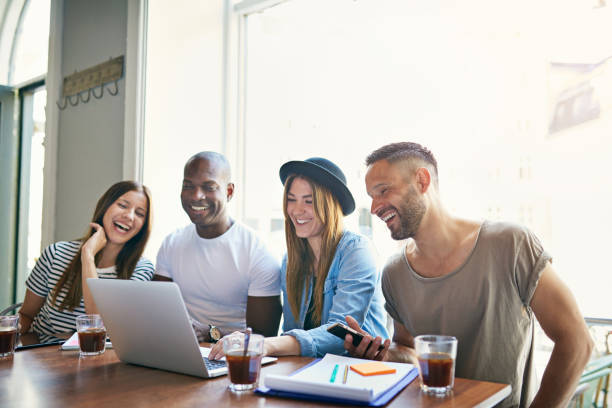 istock Group of young co-workers sitting with laptop 682282320