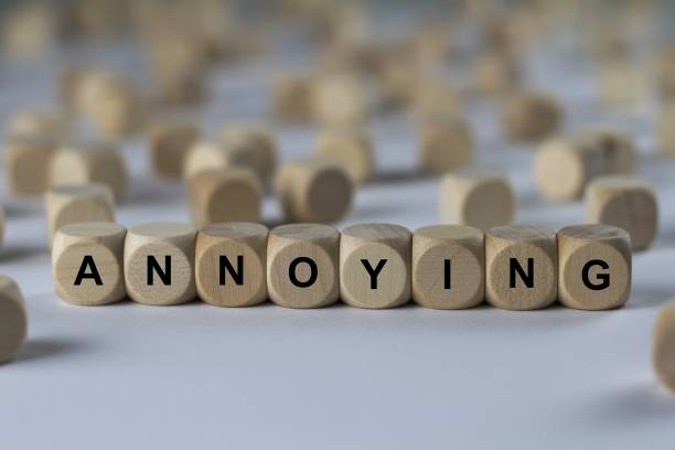 istock annoying - cube with letters, sign with wooden cubes 682282378