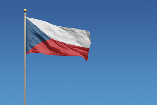 Flag of Czech Republic in front of a clear blue sky