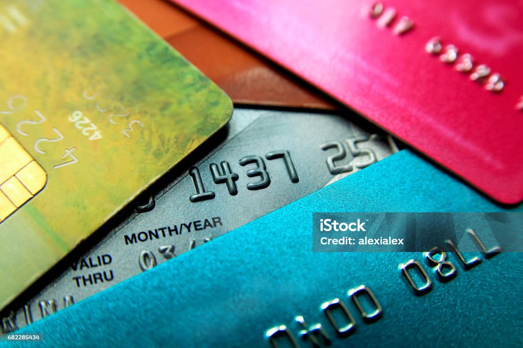 Stack of multicolored credit cards close-up view with selective focus. Credit Card Stock Photo