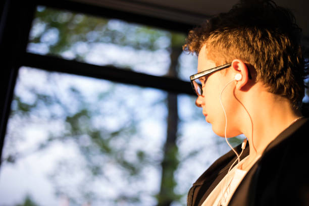 istock teenage boy on the tram 682286018