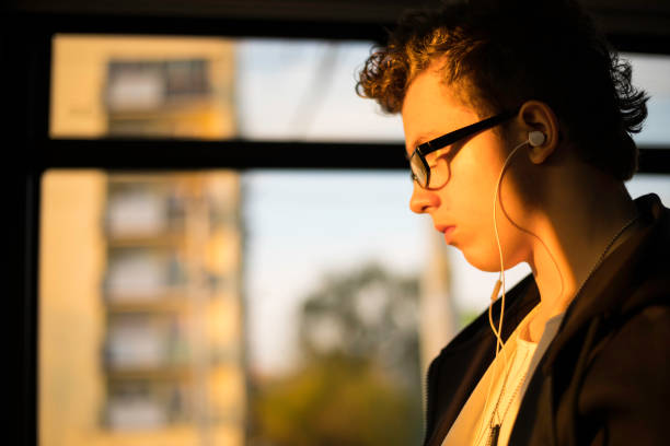 istock teenage boy on the tram 682286020