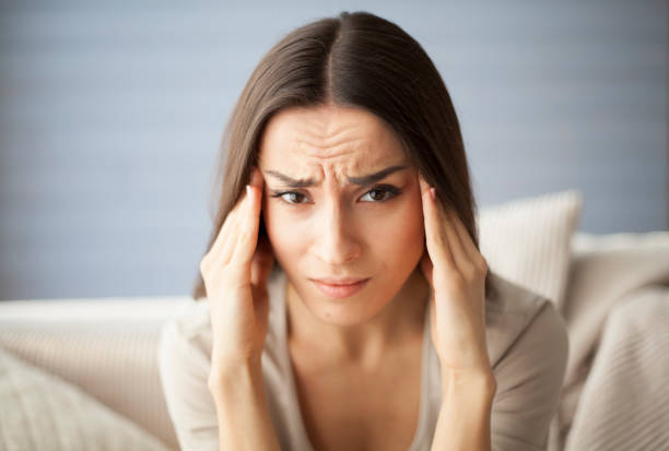 istock Strong headache. Girl look at the camera. 682289634