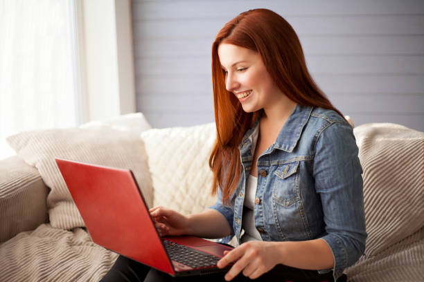 istock Young beautiful girl is working at the laptop. 682291856