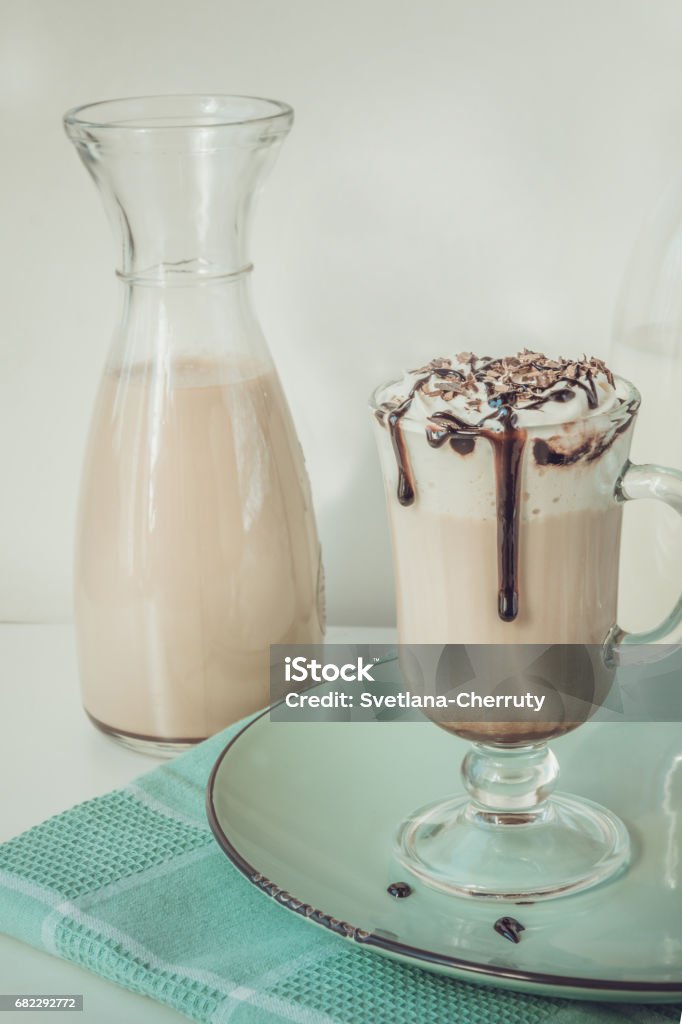 Hot coffee latte with thick foam and grated chocolate. Vintage toned. Breakfast Stock Photo