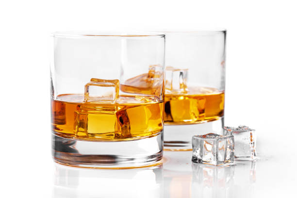 istock whiskey glasses with ice cubes isolated on white background 682299022