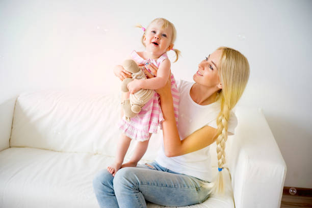 istock Mother playing with her baby daughter 682299116