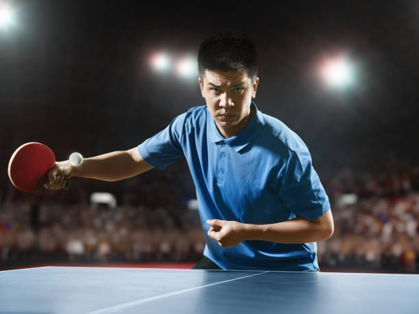 istock Young asian ping pong player playing table tennis game 682299608