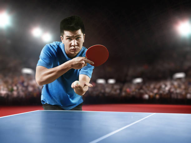 istock Young asian ping pong player playing table tennis game 682299610