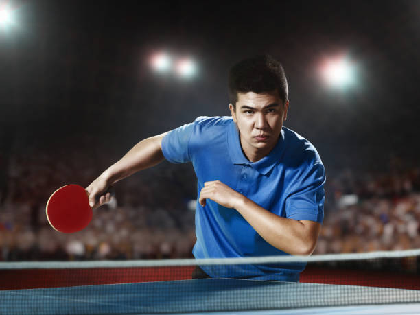 istock Young asian ping pong player playing table tennis game 682299626