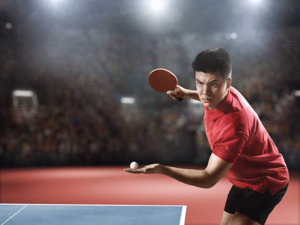 istock Young asian ping pong player playing table tennis game 682299642