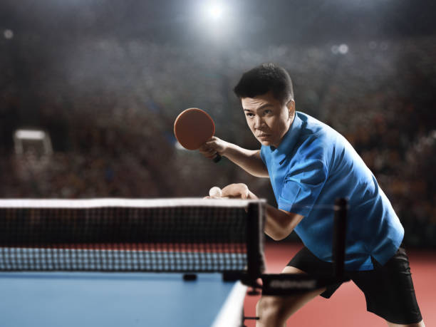 istock Young asian ping pong player playing table tennis game 682299658