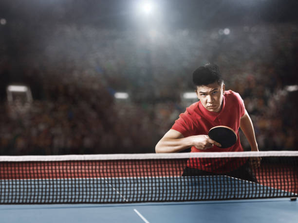 istock Young asian ping pong player playing table tennis game 682299660