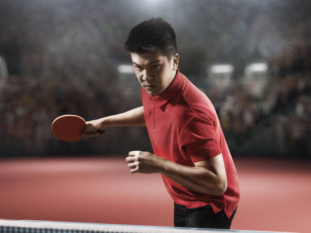 istock Young asian ping pong player playing table tennis game 682299662