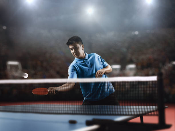 istock Young asian ping pong player playing table tennis game 682299758