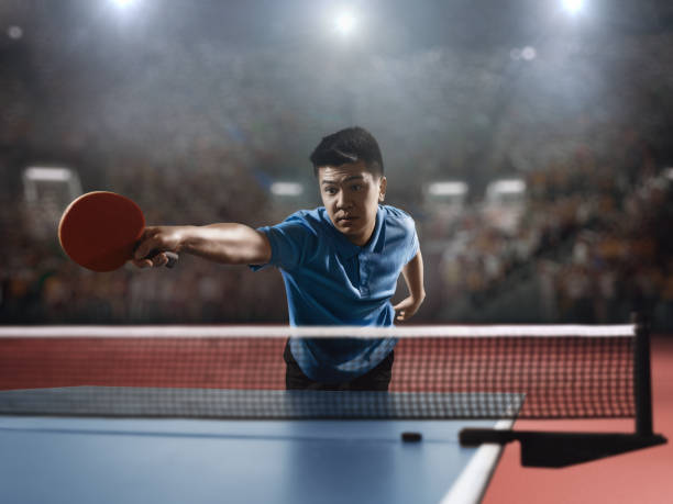 istock Young asian ping pong player playing table tennis game 682299760