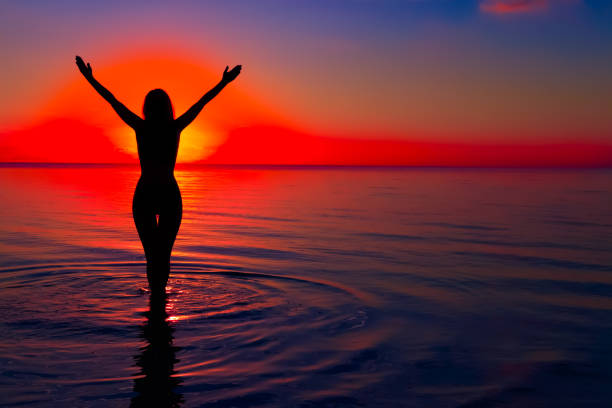 istock Girl silhouette on water 682299956