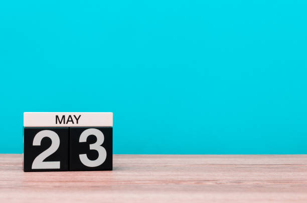 May 23rd. Day 23 of month, calendar on turquoise background. Spring time, empty space for text
