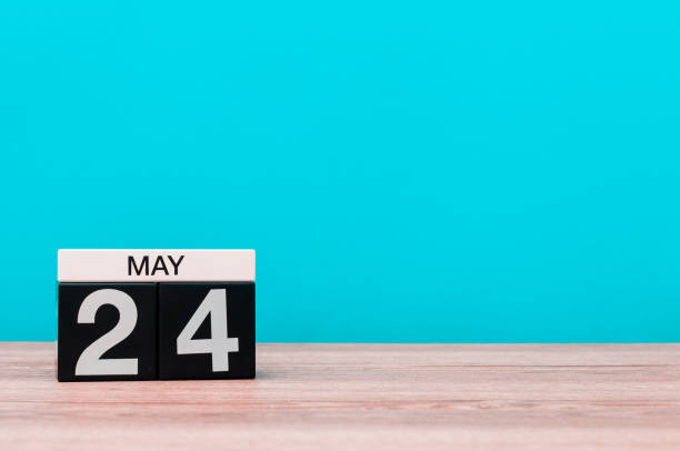 istock May 24th. Day 24 of month, calendar on turquoise background. Spring time, empty space for text 682300070