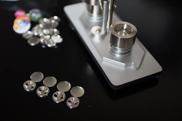 istock Pins press machine with empty pins and ready pins. Press button maker for 2,5 cm badge. 682308216