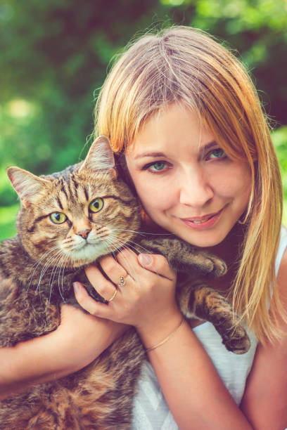 istock Young woman and her cat 682312268