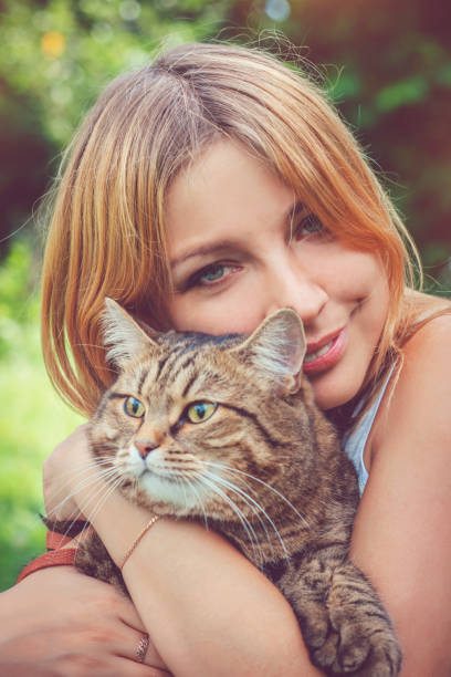 istock Young woman and her cat 682312412