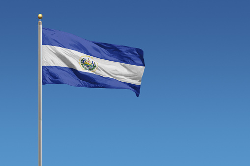 Flag of El Salvador on a clear blue sky