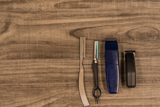 istock Hair cutting Tools on Wood Background 682318370