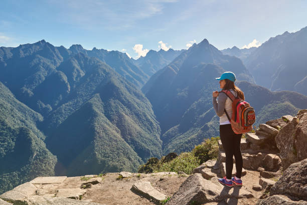 istock Woman with backpack on mountain background 682319194