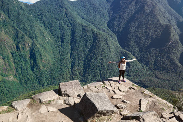 istock One happy girl on mountain peak 682319220