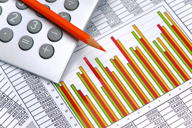 istock financial chart and table sheet with calculator show success at exchange market 682319644