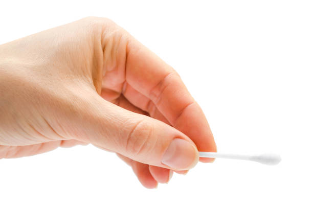istock woman hand holding cotton ear bud. 682323006