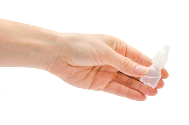 istock woman hand holding white medicine bottle 682323014
