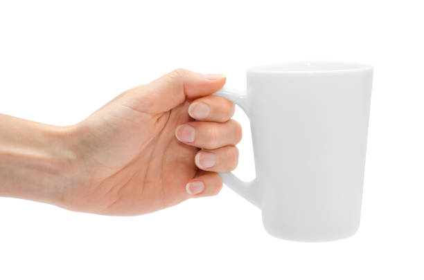 istock woman hand holding white cup. 682323028
