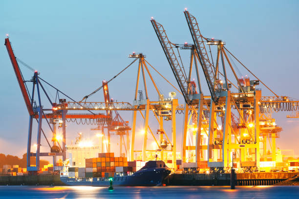 istock Container Ship Being Unloaded at Dusk, Hamburg Harbor, Germany 682325350