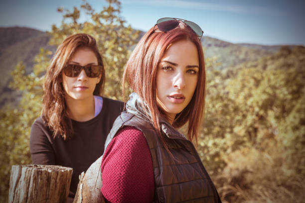 Two beautiful girls hiking in nature on a amazing summer day
