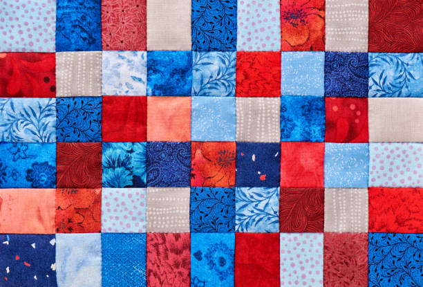 istock Blue and red square pieces of fabric sewn together 682326262