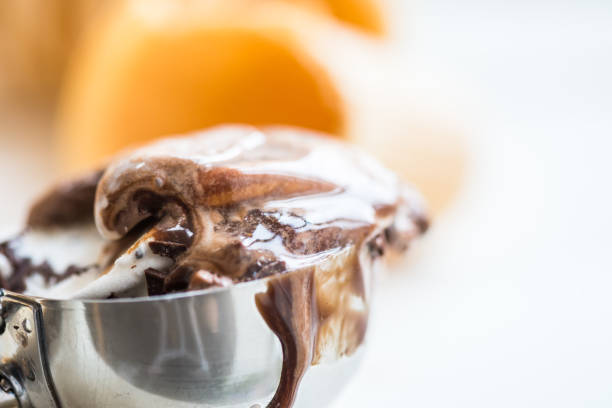 Vanilla and Chocolate Ice Cream Scoops in Waffle Cup Cones on Light Background
