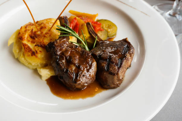 istock A delicious dish of lamb steak with smash potato. 682329132