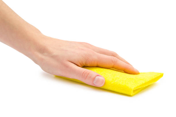 istock female hand takes or gives rag. 682329822