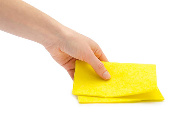 istock female hand takes or gives rag. 682329842