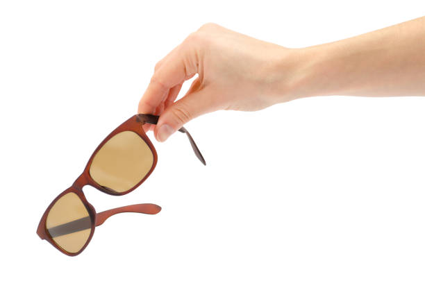 female hand takes or gives sunglasses. stock photo