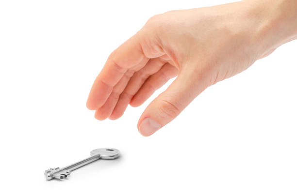 istock female hand takes or gives key. 682331502