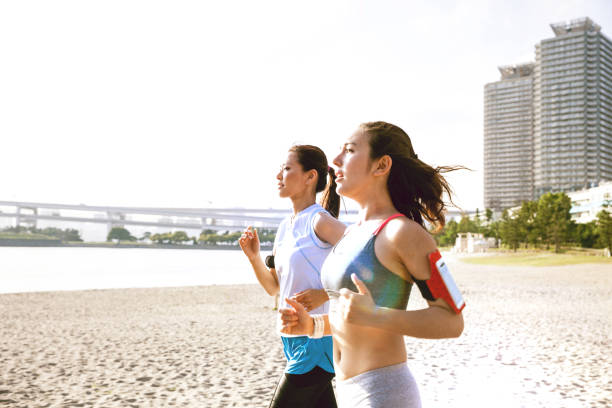 istock Women getting fit taking run afterwork in Tokyo 682336800