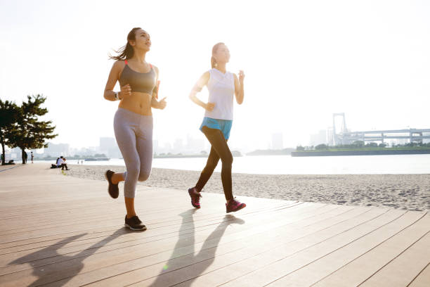 istock Women getting fit taking run afterwork in Tokyo 682336822