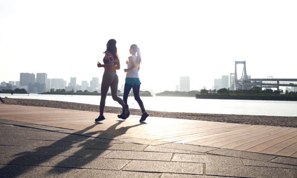 istock Women getting fit taking run afterwork in Tokyo 682336836