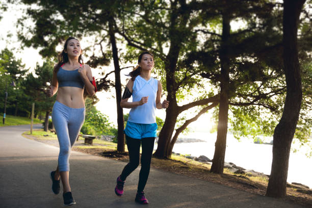istock Women getting fit taking run afterwork in Tokyo 682336978