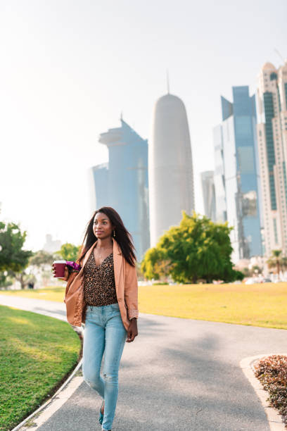 istock tourist in the doha la corniche park walking 682339468