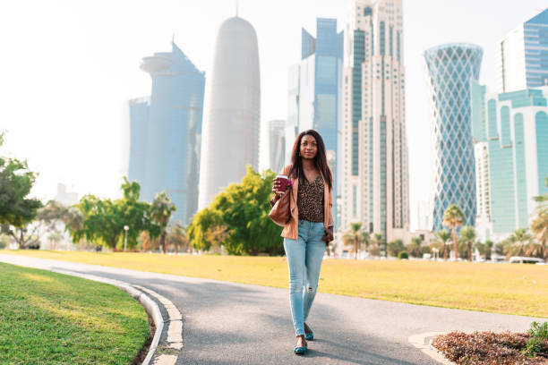 istock tourist in the doha la corniche park walking 682339586